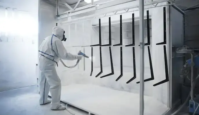 Automotive part hung on the powder coating line ready for the oven